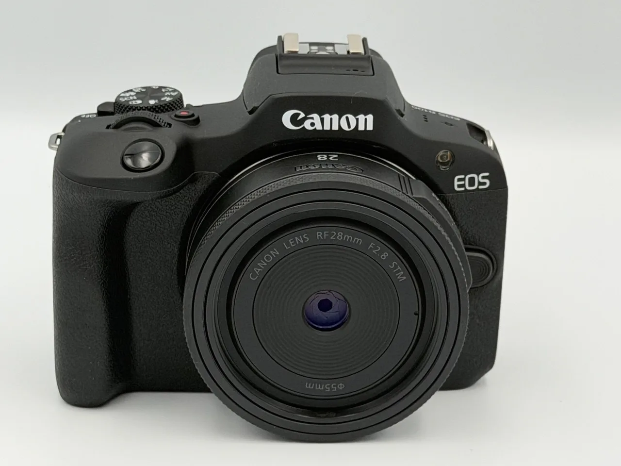 My Canon EOS R100 with the RF 28mm f/2.8 STM pancake lens, straight on.